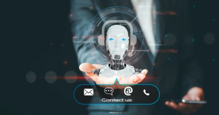 A imagem apresenta um robô humanoide com características metálicas e olhos brilhantes azuis, simbolizando inteligência artificial (IA). Ele está posicionado sobre a palma da mão de uma pessoa vestida com um terno, representando a interação entre tecnologia avançada e o mundo corporativo. No plano inferior, há ícones relacionados a comunicação, como envelope, mensagem, símbolo de arroba e telefone, junto à frase "Contact us". O fundo escuro é complementado por elementos gráficos futuristas, como linhas e círculos, destacando o conceito de inovação tecnológica.