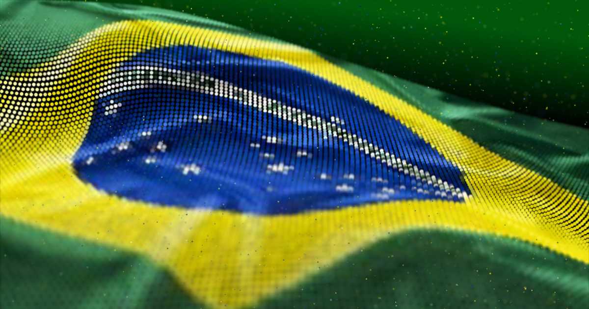 Bandeira do Brasil ondulando com efeito gráfico de pontos sobre a imagem. A composição mantém as cores e elementos tradicionais da bandeira — verde, amarelo, azul e branco — com o círculo azul ao centro contendo a faixa branca com o lema “Ordem e Progresso” e estrelas brancas representando constelações. O efeito de pontos dá um visual digital e moderno à imagem (ABES, IA)