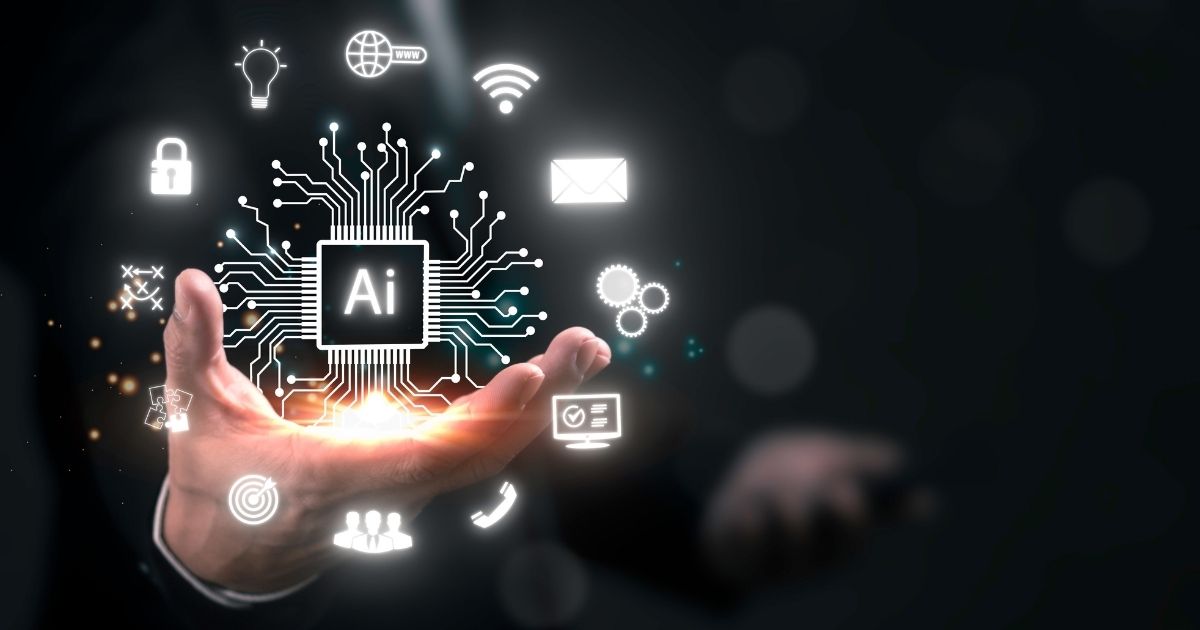 A imagem apresenta um conceito visual futurista relacionado à Inteligência Artificial e tecnologia digital. Detalhes principais: Elemento central: Um circuito eletrônico estilizado com a sigla “AI” no centro, representando um processador ou núcleo de inteligência artificial. Linhas conectadas irradiam do chip, formando uma rede que simboliza conectividade e processamento avançado. Ícones ao redor: Cadeado (segurança digital). Globo com WWW (internet e conectividade global). Wi-Fi (conexão sem fio). Envelope (comunicação digital). Engrenagens (automação e processos). Lâmpada (inovação e ideias). Alvo (precisão e estratégia). Usuários (interação humana). Carrinho de compras (e-commerce). Contexto físico: Uma mão aberta sustentando a projeção digital, sugerindo controle ou domínio sobre a tecnologia. Fundo escuro com iluminação suave, destacando os elementos digitais em tons de branco e azul brilhante, criando uma estética moderna e tecnológica. Essa imagem transmite inovação, integração de IA em diferentes áreas (segurança, comunicação, automação, comércio) e transformação digital. pib, AIops, ceos